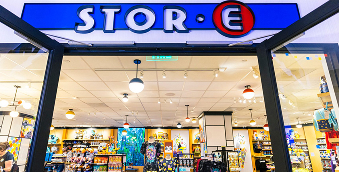 The store in the Pixar Place Hotel features snacks and souvenirs. The sign over the door spells out S-T-O-R-E in imitation of the logo for the film Wall-E.