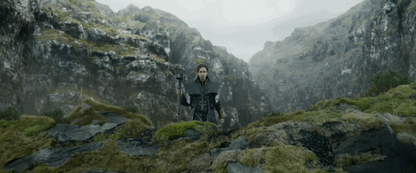 A gif of Dar-Benn approaching the edge of a cliff while holding a Cosmi-Rod