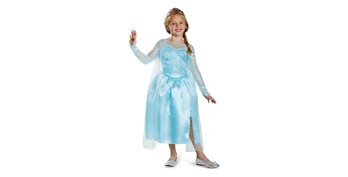 A girl poses in a costume inspired by Elsa’s snow queen gown from Frozen