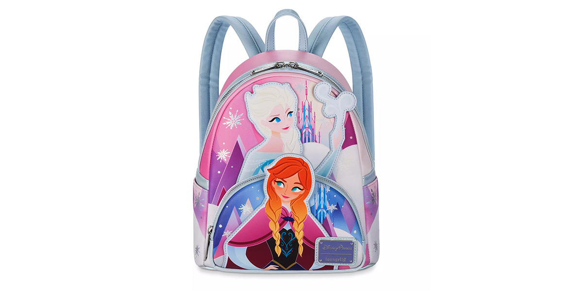 A purple and blue backpack featuring an illustration of Elsa using her ice powers behind Anna, who is standing with her hands on her hips.