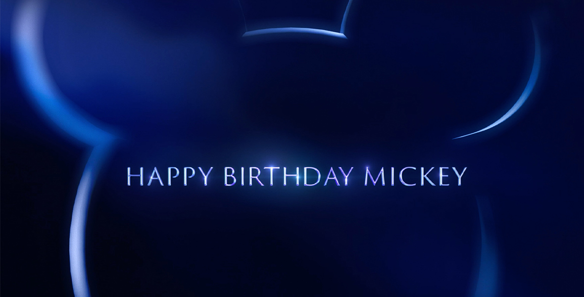 The phrase "Happy Birthday Mickey" is written in all white letters and centered against a blue background. A light blue silhouette of Mickey Mouse's head frames the text.