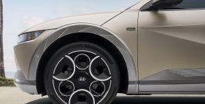 The front driver-side wheel of the 2024 IONIQ 5 Disney100 Platinum Edition. A hidden Mickey detail can be seen toward the bottom of the wheel.