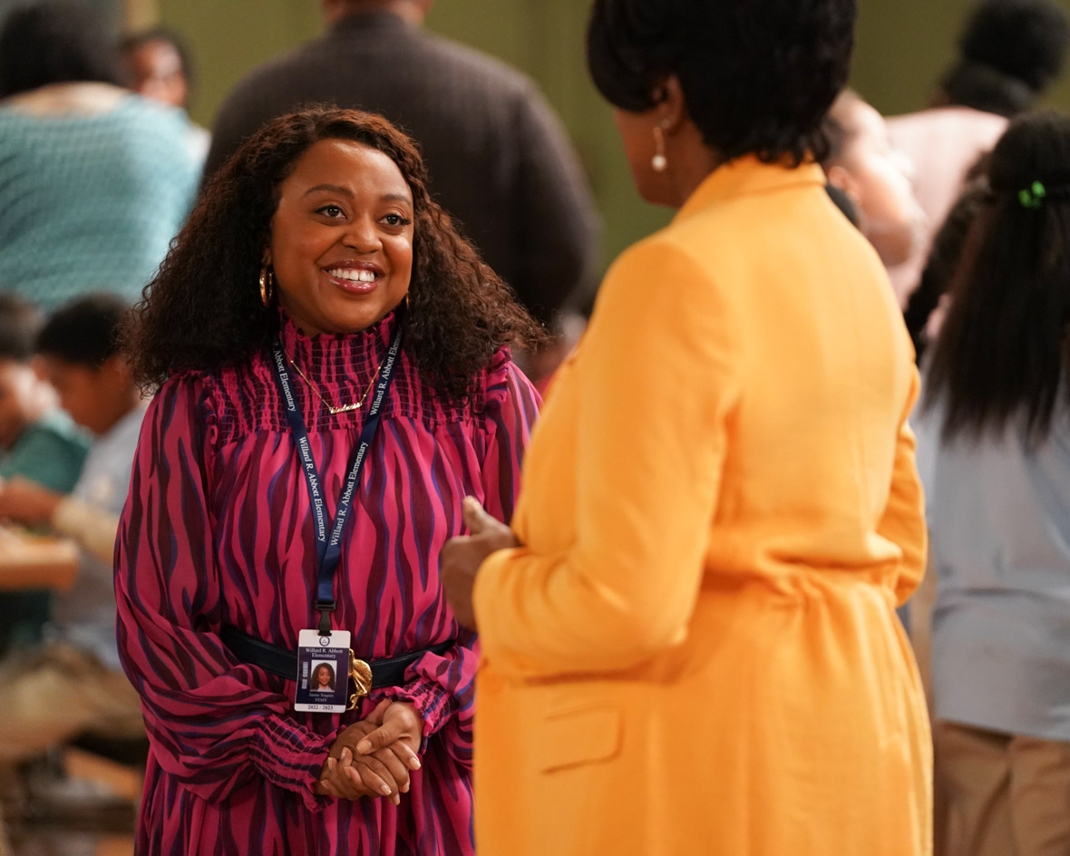 Janine Teagues, played by Quinta Brunson, talks to Barbara Howard, played by Sheryl Lee Ralph, in a scene from Abbott Elementary. They are standing in the cafeteria.