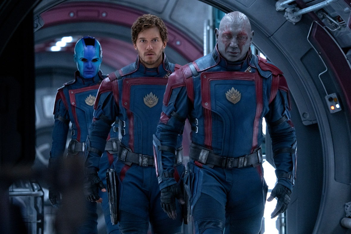 Nebula, played by Karen Gillan, Peter Quill, played by Chris Pratt, and Drax, played by Dave Bautista, suit up for battle in a scene from Guardians of the Galaxy Vol. 3.