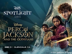 Promotional image for the D23 Spotlight Series featuring Disneys Percy Jackson and the Olympians, showing three characters (from left to right: Grover, Annabeth, and Percy) in action poses with Percy holding a gold sword. The trio is set against a dramatic stormy background with swirling clouds and water. Text at the bottom notes the event will take place December 5 in Glendale, CA.