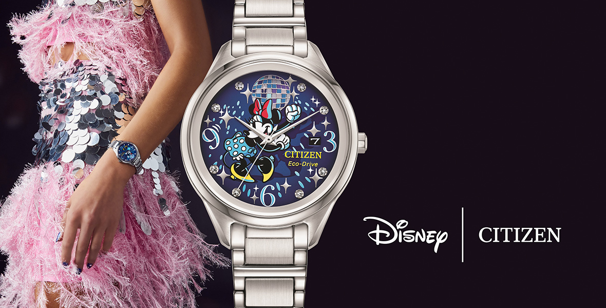 A woman festively attired in a silver and pink feathered dress stands in profile with a Citizen watch on her wrist. Next to her is a close-up of the watch featuring Minnie Mouse with a disco ball. The logo “Disney | Citizen is at the lower right corner.