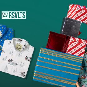 At left in profile is a man with Santa hat on and a holiday RSVTS short-sheeve shirt. He holds several wrapped presents precariously. At left are three RSVTS shirts with holiday-inspired prints. The logo Disney| RSVTS at top.
