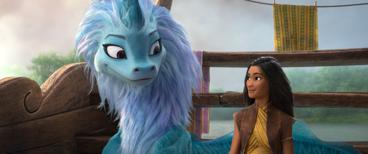 Raya and Sisu are in a wooden boat that is on water. They are sitting at the back end of the boat, and they are looking at each other, smiling. Raya wears a form-fitting, yellow tunic and a short-sleeve, brown jacket with detailing.