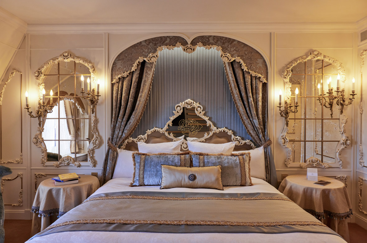 The Princely Suite features a luxurious bed with a baroque canopy and furnishings.