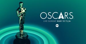 An Oscar statue is bathed in teal light. Its base is surrounded by rings in four different shades of teal. To its right is the Oscars logo and tune-in information for ABC.
