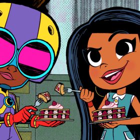 Lunella (voiced by Diamond White), in her Moon Girl costume with helmet and goggles, is eating a raspberry dessert along with her best friend, Casey (voiced by Libe Barer).