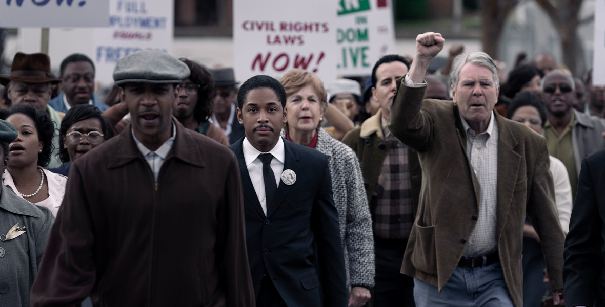 In Genius: MLK/X, Martin Luther King Jr., played by Kelvin Harrison Jr., marches in protest.