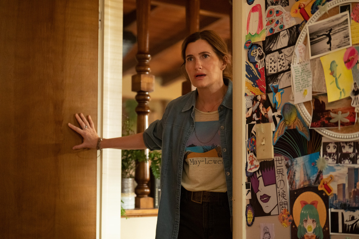 In a scene from Hulu’s Tiny Beautiful Things, Clare Pierce, played by Kathryn Hahn, stands in her teenage daughter’s doorway and has a shocked expression on her face.