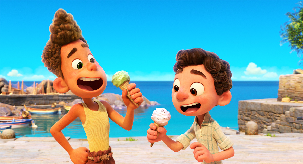 Luca and Alberto, in their human boy forms, enjoy ice cream by the sea. Alberto sports a vibrant yellow tank top, while Luca dons a beige, linen, checked shirt.