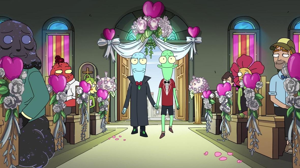 Aliens Korvo (left) and Terry (right) and are walking down a church isle. Korvo is wearing a dark gray cloak and a red bowtie, and Jesse is wearing gray bermuda shorts, a red short-sleeve top, and a black bowtie. The church is adorned with white roses and pink hearts. Other characters the  show are sitting in the pews, looking at the two aliens.