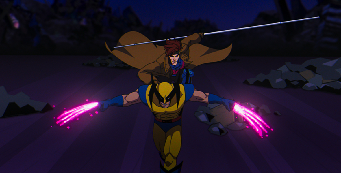 Gambit and Wolverine are running, with Wolverine leading in a scene from the new animated series X-Men ’97. Wolverine is wearing his Super Hero attire: a yellow and black suit with black details on the mask. His hands have neon pink claws extended. Gambit is holding a long silver spear and is also dressed in his Super Hero attire, consisting of a blue and pink suit covered by a long brown coat. The background depicts a nighttime scene with rocks scattered on the ground.
