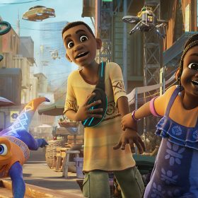 In a scene from the show Iwájú set in Lagos, Nigeria, children Tola and Kole are running through an outdoor market. Tola wears an orange T-shirt with purple overalls, while Kole dons a yellow T-shirt with orange, brown, and green detailing, paired with green cargo shorts, sandals, and a black fanny pack adorned with neon blue strips. Accompanying them is Otin, a purple and orange robotic pet lizard. In the backdrop, towering buildings loom over hovering vehicles.