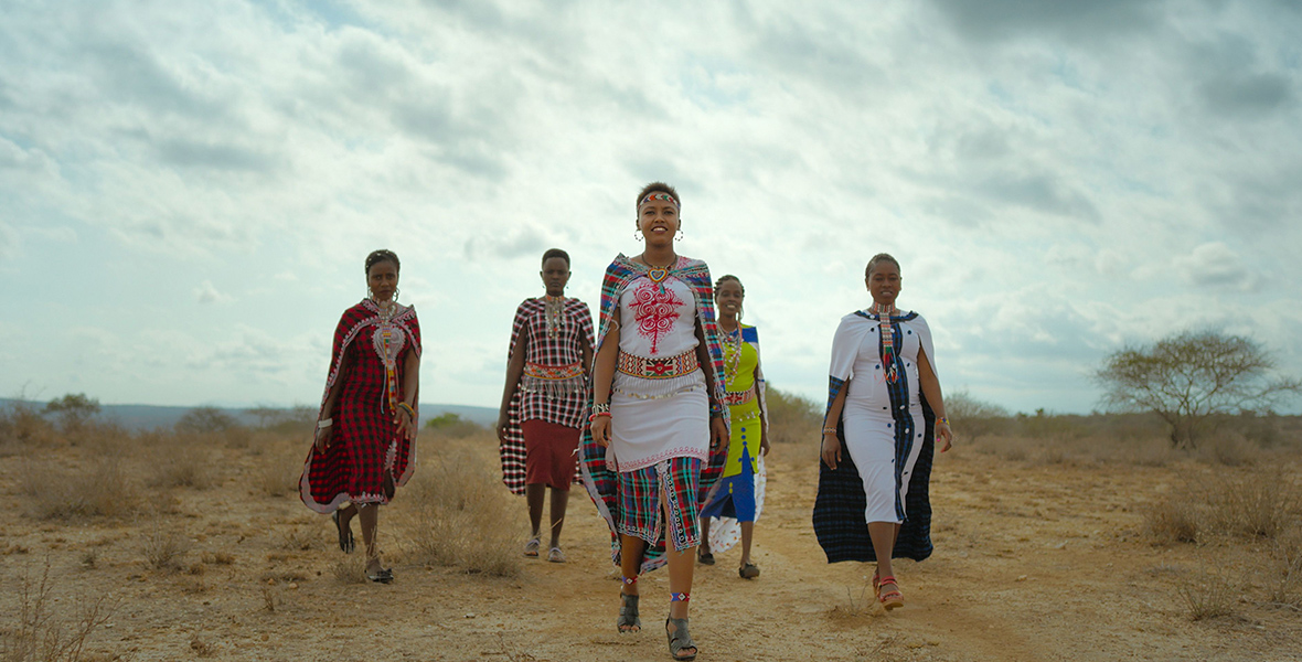 In a scene from Queens, The Team Lioness unit, consisting of five women, are seen walking on the African plain in their traditional garb.