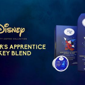 Promotional image for the Disney Specialty Coffee Collection featuring "Sorcerer's Apprentice Mickey Blend" by Joffrey's Coffee & Tea Company. The image showcases the product packaging, which includes a bag of ground coffee and a K-Cup pod, both featuring an illustration of Mickey Mouse dressed as the Sorcerer's Apprentice. The text highlights the medium roast coffee with sweet citrusy notes and a smooth finish.