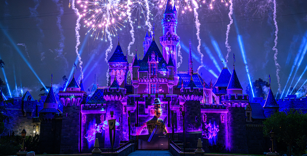During the Together Forever – A Pixar Nighttime Spectacular, dazzling fireworks illuminate the sky above Disneyland’s iconic Sleeping Beauty Castle. On the castle is a purple and blue projection showcasing moments from Soul, featuring Joe Gardner.