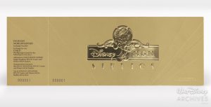 This commemorative ticket is on gold cardstock paper. The Disney-MGM Studios logo is in gold foil in the center. The bottom left corner of the ticket reads &ldquo;000001,&rdquo; indicating it was the first commemorative ticket printed for the opening of this park.