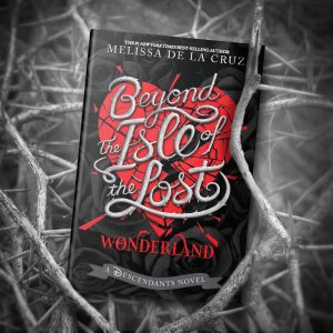 A black and white image featuring the book cover of "Beyond the Isle of the Lost: Wonderland" by Melissa de la Cruz. The cover has a bold red heart surrounded by thorny vines with a silver, curly font for the title. The background consists of intertwined thorny branches, enhancing the dark, mystical theme of the book. The tagline indicates it is a "Descendants Novel."