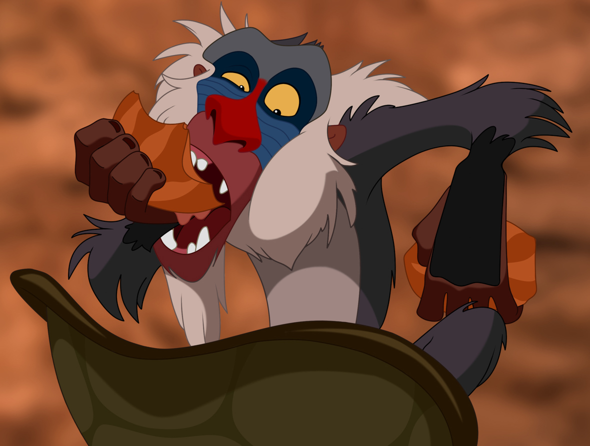 Rafiki, from The Lion King, is sitting on the ground eating a piece of fruit as he looks into an upside-down turtle shell.
