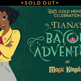 Image depicting event name in gold and shades of green: “D23 Gold Member Celebration. Tiana’s Bayou Adventure at Magic Kingdom.” Tiana is wearing a yellow blouse, maroon scarf, and green-gray pants, looking straight forward, smiling with her arms crossed, standing at left next to the name of the event against a background of gilded art-deco style patterns with gold and plush green. A banner at top reads “SOLD OUT”