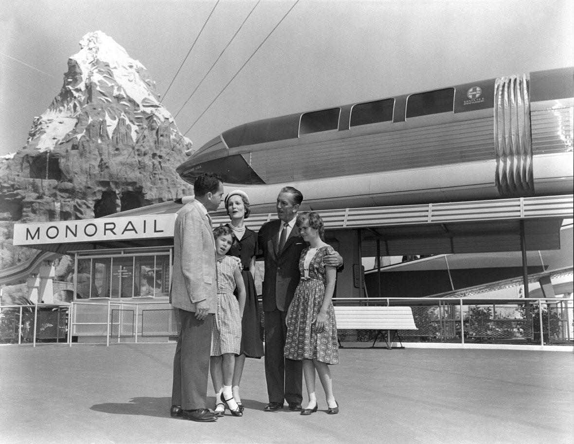 Walt Disney and his family in front of the Monorail station.