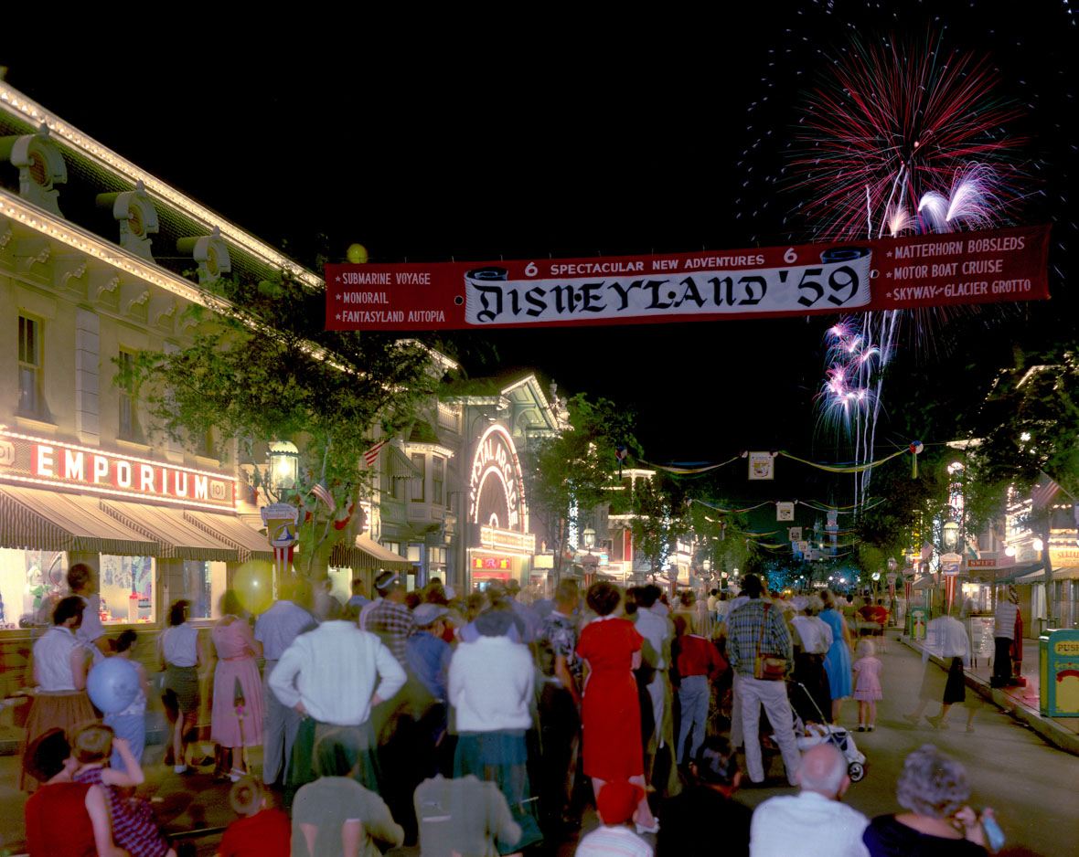 A Disneyland '59 banner hangs above Mainstreet, U.S.A., during a fireworks show.