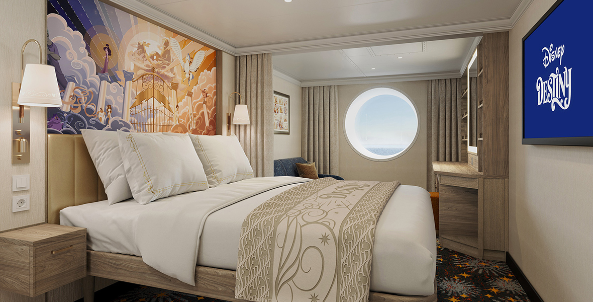 An artist rendering of a Disney Destiny Oceanview Stateroom depicts Hercules-inspired artwork that hangs above a leather headboard. The bed is dressed in white and gold linens. The Disney Destiny logo is displayed on the TV screen on the opposite wall.