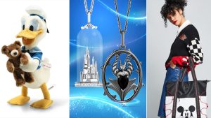 The image is a collage featuring three distinct Disney-themed items. On the left, there is a plush toy of Donald Duck wearing his classic sailor outfit and holding a small teddy bear, showcasing a cute and cuddly design. In the center, there are two pieces of Disney-themed jewelry against a blue, starry background. One is a silver necklace featuring a detailed miniature of Cinderella's Castle encased in a glass dome. The other is a pendant of Maleficent in her dragon form, intricately designed with a black gemstone at the center. On the right, there is a stylish young woman wearing a black and white varsity-style jacket with a checkered sleeve design, holding a large tote bag. The tote bag is black and white with a Mickey Mouse face prominently displayed on the front, combining fashion with a touch of Disney magic.