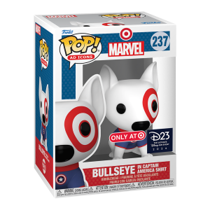 Target’s canine mascot Bullseye, who is white with the signature red circle around his eye, wears a custom blue t-shirt with the Captain America shield on it. He sits in a white Funko box that features the Target logo, Marvel logo, Funko Pop! Logo, D23 Event logo, and an enlarged image of the item.
