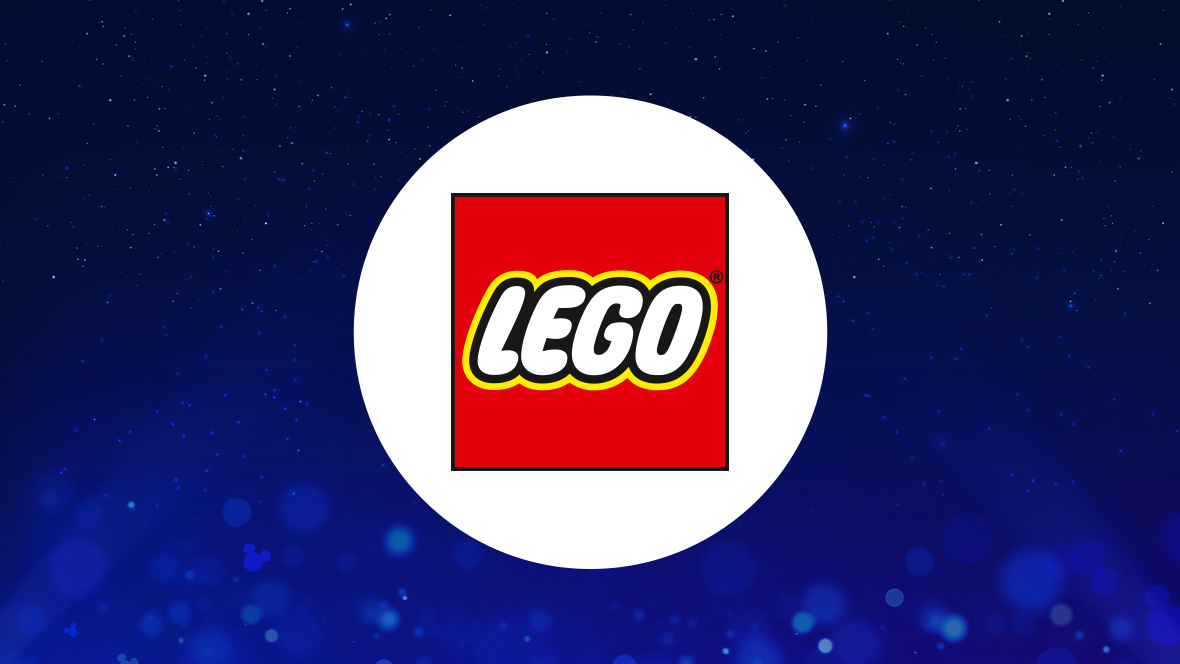 The image features a white circle centered on a dark blue background with subtle sparkling light effects. Inside the circle is the LEGO logo, which consists of the word "LEGO" written in bold, white, uppercase letters with a black and yellow outline. The text is set against a bright red square background.