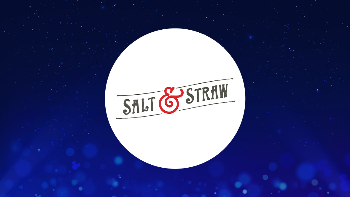 The image shows a logo for Salt & Straw on a dark blue background with a white circle in the center. Inside the circle, the logo features the words "SALT & STRAW" in stylized black letters, with the ampersand (&) in red and designed to resemble a swirl. The text is placed between two horizontal lines with dots at each end, creating a vintage feel.