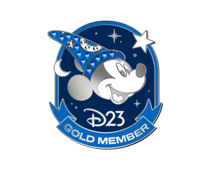 The image shows a D23 Gold Member pin featuring Mickey Mouse. Mickey is depicted in profile, smiling and wearing the iconic sorcerer's hat adorned with blue gemstones and celestial symbols like stars and moons. The background is a dark blue, starry night sky with additional stars scattered around Mickey. Below Mickey's image, the D23 logo is prominently displayed, and a blue ribbon at the bottom reads "GOLD MEMBER." The overall design is elegant and highlights the prestigious Gold Member status within the D23 Disney Fan Club.