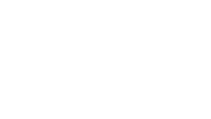 The image is a black and white illustration of a sign for "Downtown Disney." The design is retro and stylized, with an oval-shaped central area containing the text "Downtown Disney" in a playful, cursive font. The oval is framed by a structure that resembles an old-fashioned signpost, with two curved supports on each side.