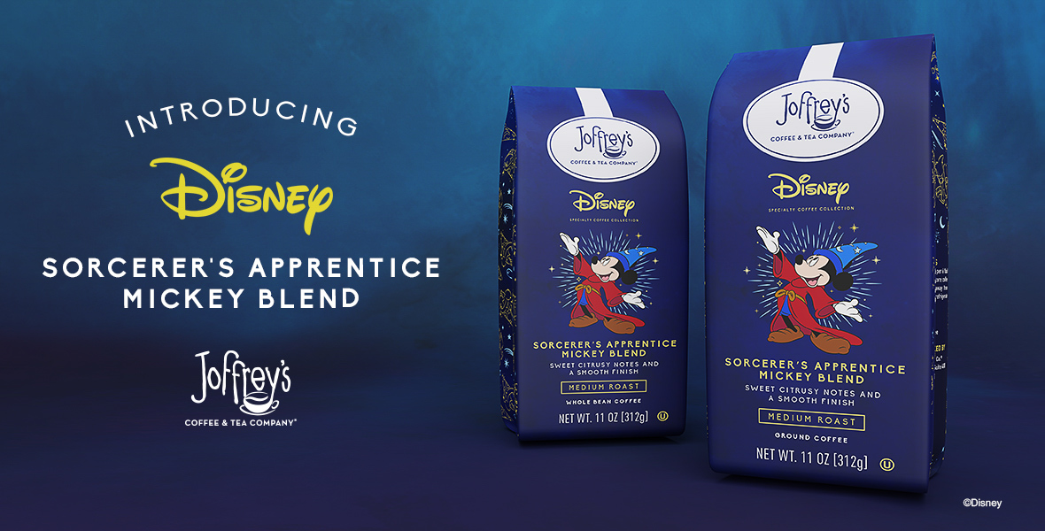 A banner for Joffrey's Coffee & Tea Company featuring their new Disney Sorcerer's Apprentice Mickey Blend. The image displays two bags of the coffee blend, one labeled as whole bean coffee and the other as ground coffee. Both bags have an illustration of Mickey Mouse as the Sorcerer's Apprentice from Fantasia. The text above the bags reads 'Introducing Disney Sorcerer's Apprentice Mickey Blend' with a description noting 'Sweet citrusy notes and a smooth finish' as a medium roast.