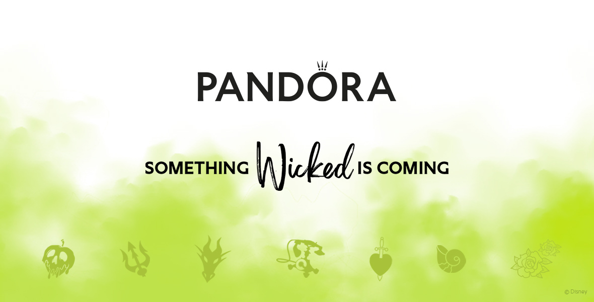 Promotional image featuring the Pandora logo with the tagline 'Something Wicked is Coming' in bold black text against a white background with a green gradient at the bottom. The image also includes various Disney villain symbols in a subtle green hue at the bottom, such as the poisoned apple, Maleficent's horns, and Ursula's shell, hinting at a new product line inspired by Disney villains.