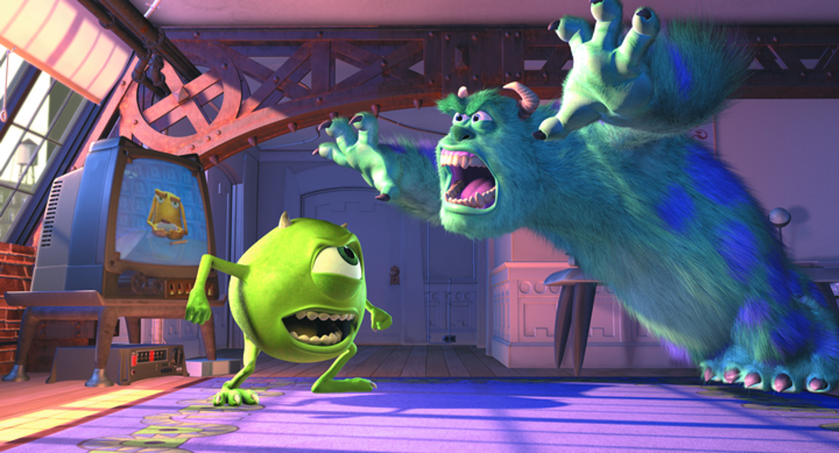 In a scene from Monsters, Inc., Mike Wazowski (voiced by Disney Legend Billy Crystal), a green one-eyed monster with two arms, legs, and small horns is arguing with James P. Sullivan (voiced by Disney Legend John Goodman), a large hairy cyan blue monster with purple spots and curved horns. They’re in an attic bedroom with windows, a purple carpet, and an old TV.