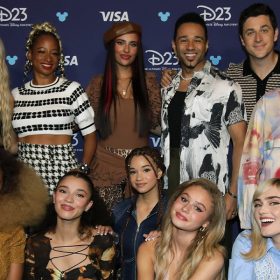 The panelists backstage before “Stay Tuned: You’re Watching Disney Channel” at D23: The Ultimate Disney Fan Event: (back row) Malachi Barton, Freya Skye, Monique Coleman, Kylie Cantrall, Corbin Bleu, David Henrie, Raven-Symoné, and Mykal-Michelle Harris; (front row) Dara Reneé, Malia Baker, Janice LeAnn Brown, Ruby Rose Turner, and Meg Donnelly.