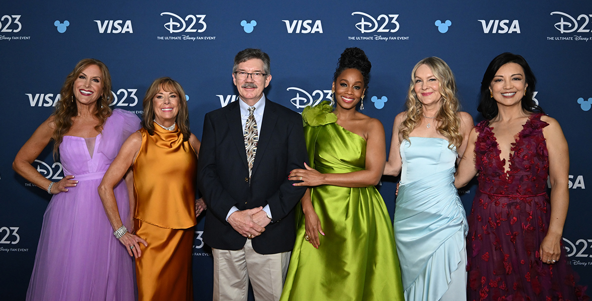 Disney Legends Jodi Benson, Paige O'Hara, Mark Henn, Anika Noni Rose, Linda Larkin, and Ming Na-Wen pose on the red carpet at D23: The Ultimate Disney Fan Event.