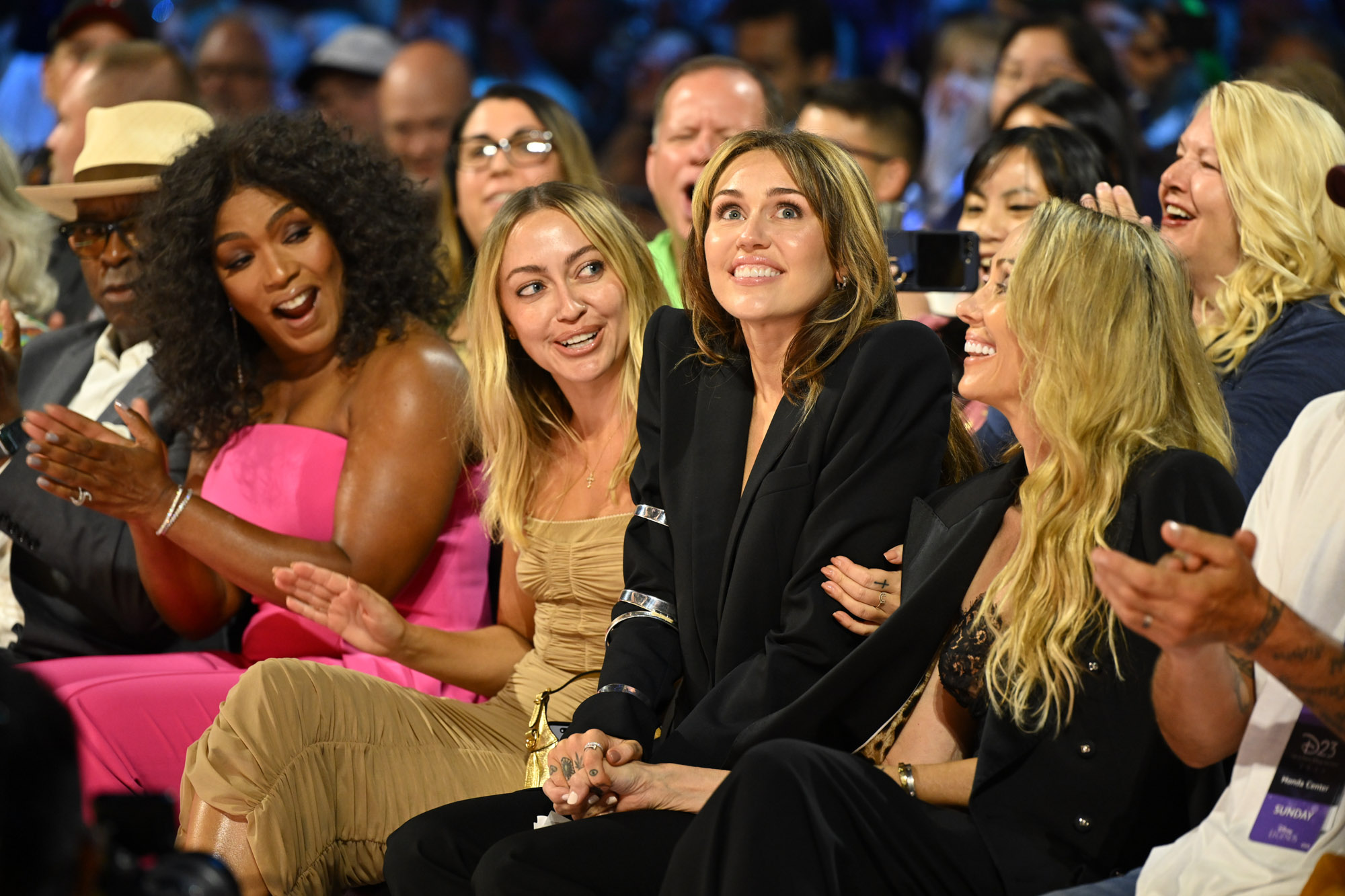 Miley Cyrus, with her mother Tish (right), in the audience at the 2024 Disney Legends Awards Ceremony at the Honda Center, during D23: The Ultimate Disney Fan Event.