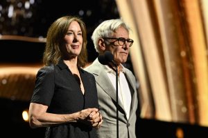 Kathleen Kennedy and Harrison Ford appear onstage to honor absent Disney Legend John Williams at the Disney Legends Awards ceremony at the Honda Center in Anaheim, California, as part of D23: The Ultimate Disney Fan Event.