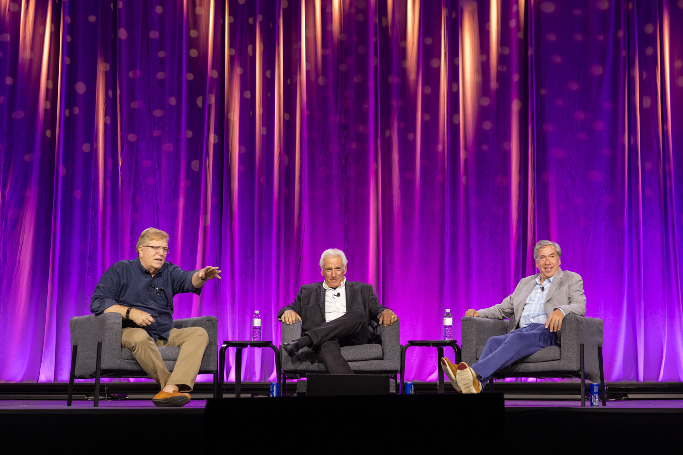 Disney historian Tim O’Day (left), Jeff Sherman (middle), and Greg Sherman (right) on stage during the “Magic Journeys: Memories of the Sherman Brothers” panel at D23: The Ultimate Disney Fan Event 2024.