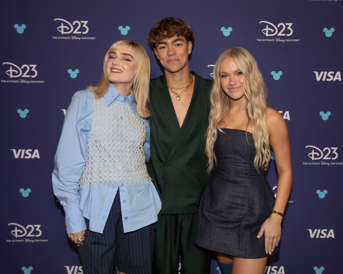 Meg Donnelly, Malachi Barton, and Freya Skye from the ZOMBIES franchise pose backstage before the “Stay Tuned: You’re Watching Disney Channel” panel at D23: The Ultimate Disney Fan Event.