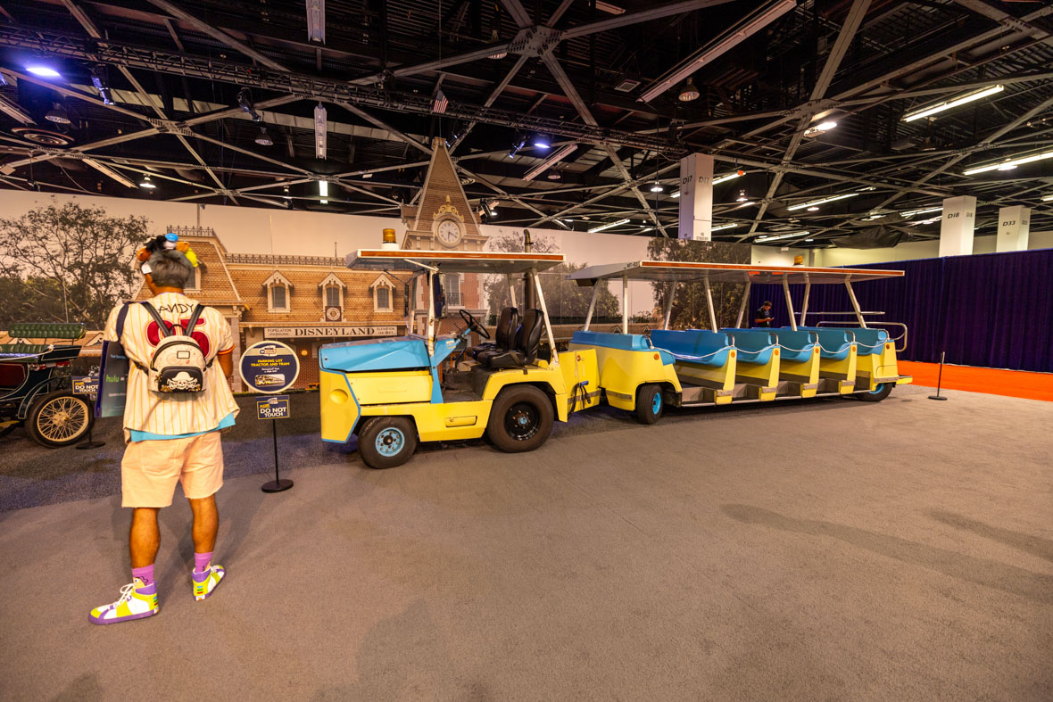 A parking lot tram used at Disneyland Park is seen on the show floor in “A Great Big Beautiful Car Show” at D23: The Ultimate Disney Fan Event.