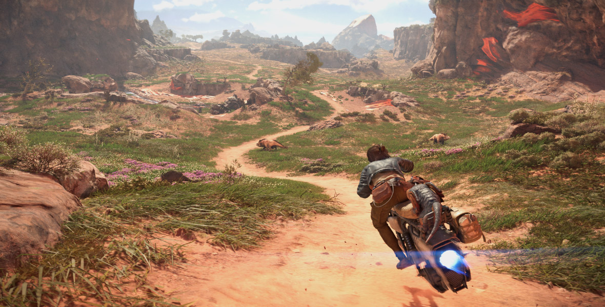 Kay Vess and Nix riding on a speeder on Toshara in Star Wars Outlaws; a moon with dirt and grass landscape with rock formations can be seen in the background.  