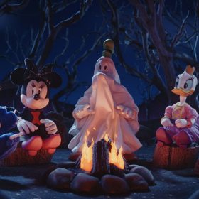 Sitting around a campfire in their Halloween costumes are the stop-motion puppets for Mickey Mouse, Minnie Mouse, Goofy (his face and body obscured by his white sheet of a ghost costume), Daisy Duck, and Donald Duck. In this scene from Mickey’s Spooky Stories, it’s nighttime and creepy trees are behind the line of characters, who are all sitting on boulders. The fire burns within a circle of smaller stones.