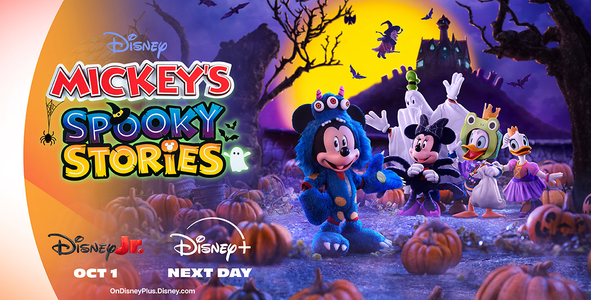 A promotional poster for Mickey’s Spooky Stories has the title of the show on the left, with the debut dates listed below: Disney Junior on October first and the next day on Disney Plus. On the right-hand side of the poster is an image of Mickey Mouse and his friends, Minnie Mouse, Donald Duck, Daisy Duck, and Goofy—all in their Halloween costumes—in a pumpkin patch. A witch on a broomstick flies overhead in the distance, along with a lot of bats, and there’s a haunted house on a hill far in the back of the image.